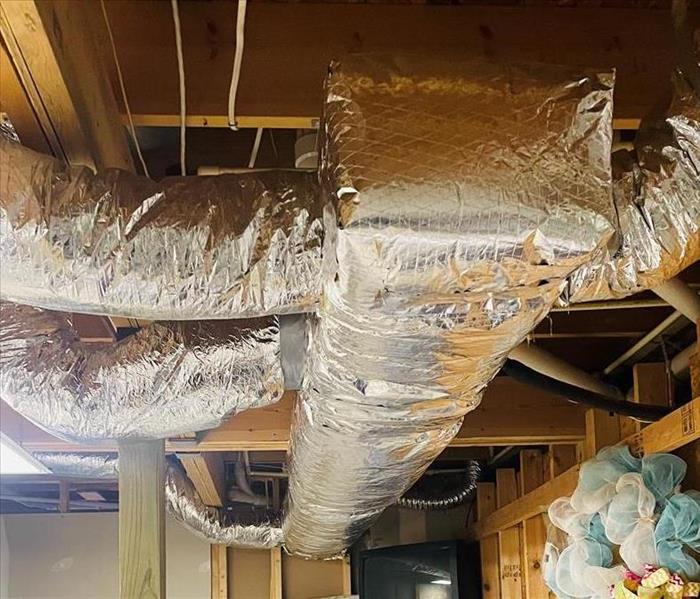 new silver insulation wrap in basement
